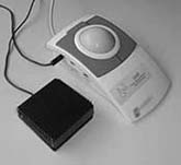 Photograph of an assistive technology switch-adapted mouse with foot pedal control